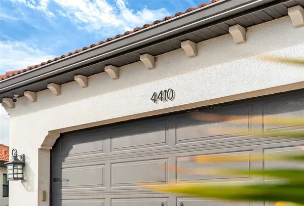 a bedroom with a bed and a mirror