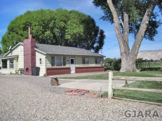 553 34 Road Clifton, CO 81520 - Photo 1 of 1 a front view of a house with a yard