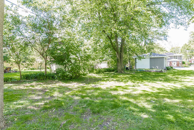 315 Lionel Road Riverside, IL 60546 - Photo 7 of 7 a view of a house with a yard