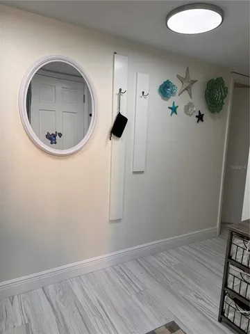 a picture of a bathroom with a sink and a mirror