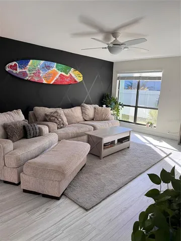 a living room with furniture and a rug