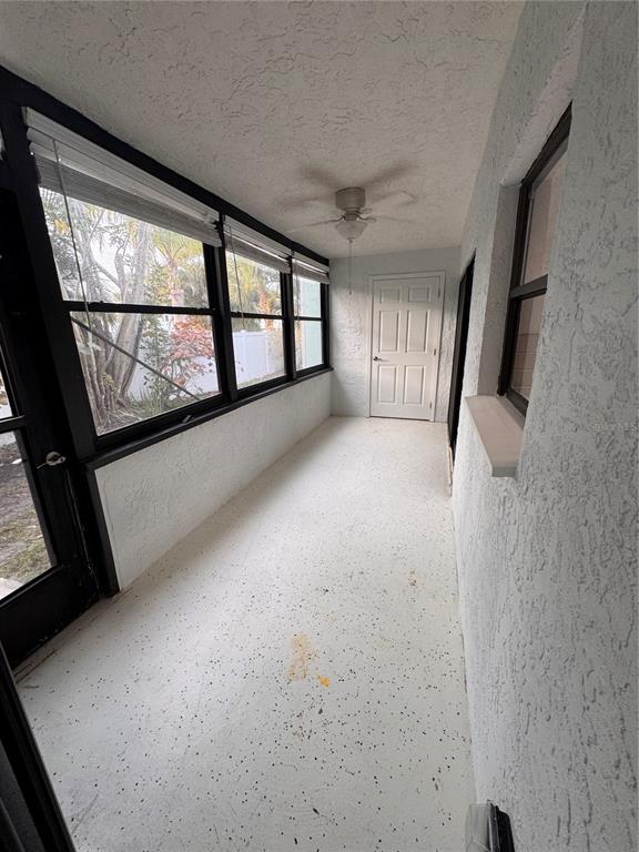 1 Windrush Boulevard, Unit 103 Indian Rocks Beach, FL 33785 - Photo 8 of 16 a view of a livingroom with an empty space and a window
