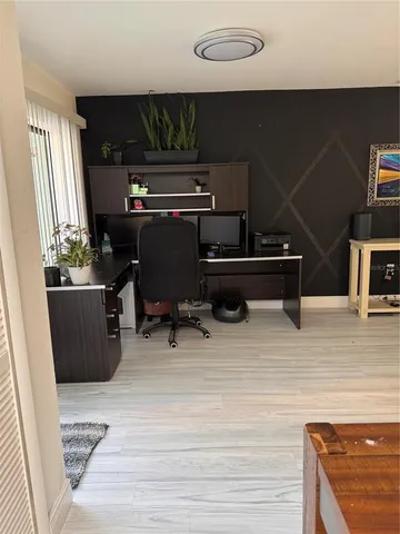 a room with furniture and a flat screen tv