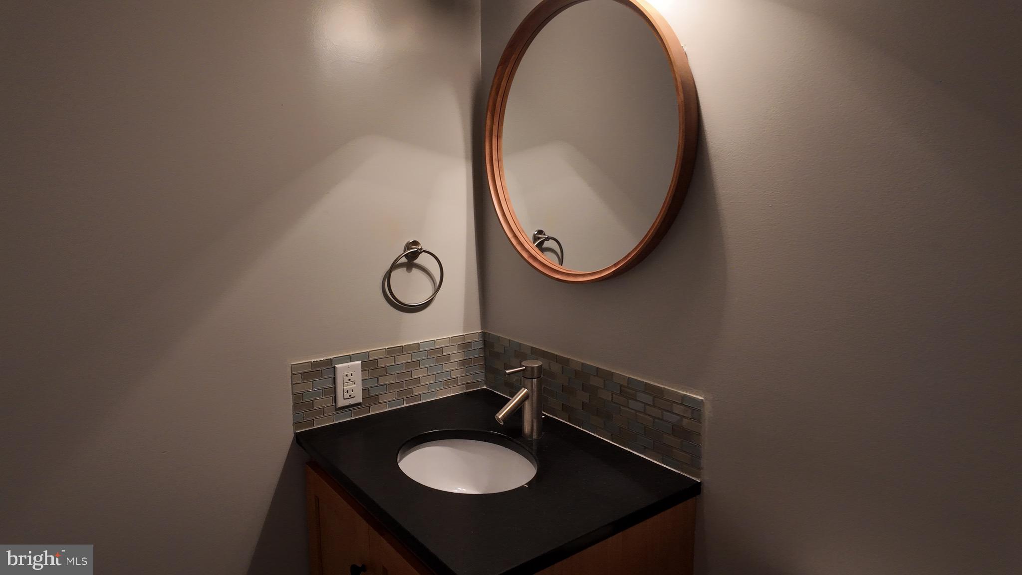 1185 Kesler Road Front Royal, VA 22630 - Photo 23 of 51 a bathroom with a sink and a mirror