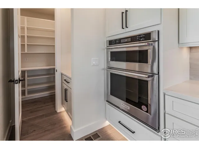 a kitchen with a stove and a microwave