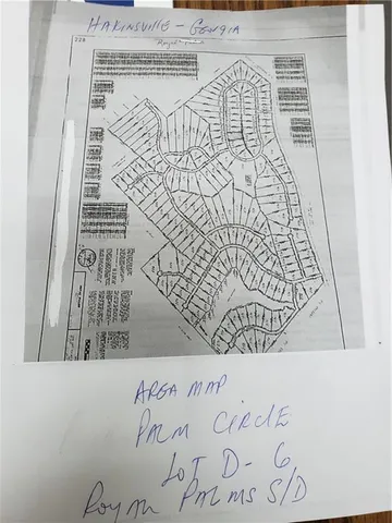 a picture of white wall with a white comforter