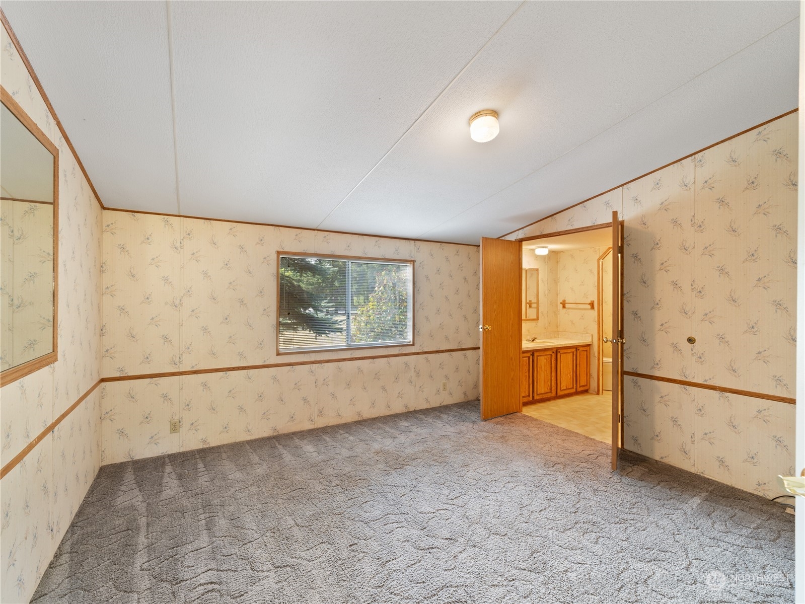 4204 Sharpe Road Anacortes, WA 98221 - Photo 24 of 39 a view of an empty room with a window