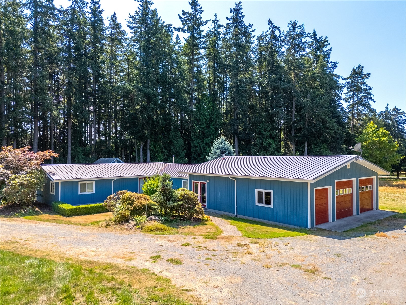 4204 Sharpe Road Anacortes, WA 98221 - Photo 3 of 39 a front view of a house with a yard