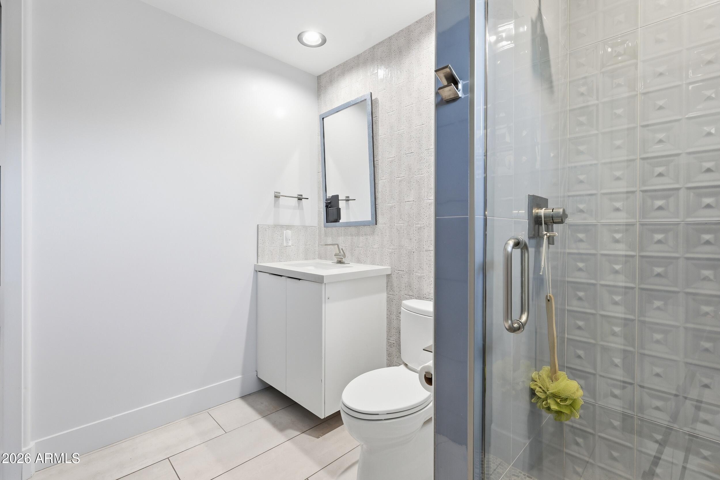 4417 East Mountain View Road Phoenix, AZ 85028 - Photo 25 of 41 a bathroom with a sink toilet and shower
