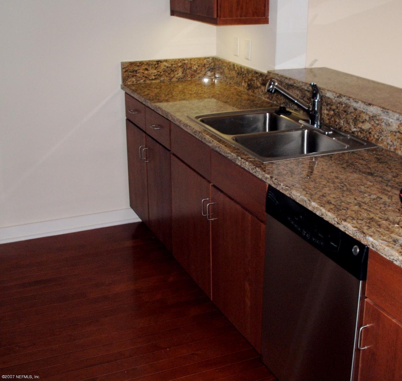 1661 Riverside Avenue, Unit 410 Jacksonville, FL 32204 - Photo 5 of 19 a kitchen with a sink and cabinets