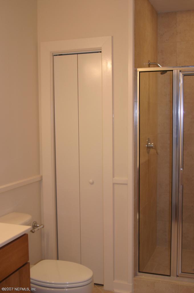1661 Riverside Avenue, Unit 410 Jacksonville, FL 32204 - Photo 7 of 19 a bathroom with a toilet a sink and shower