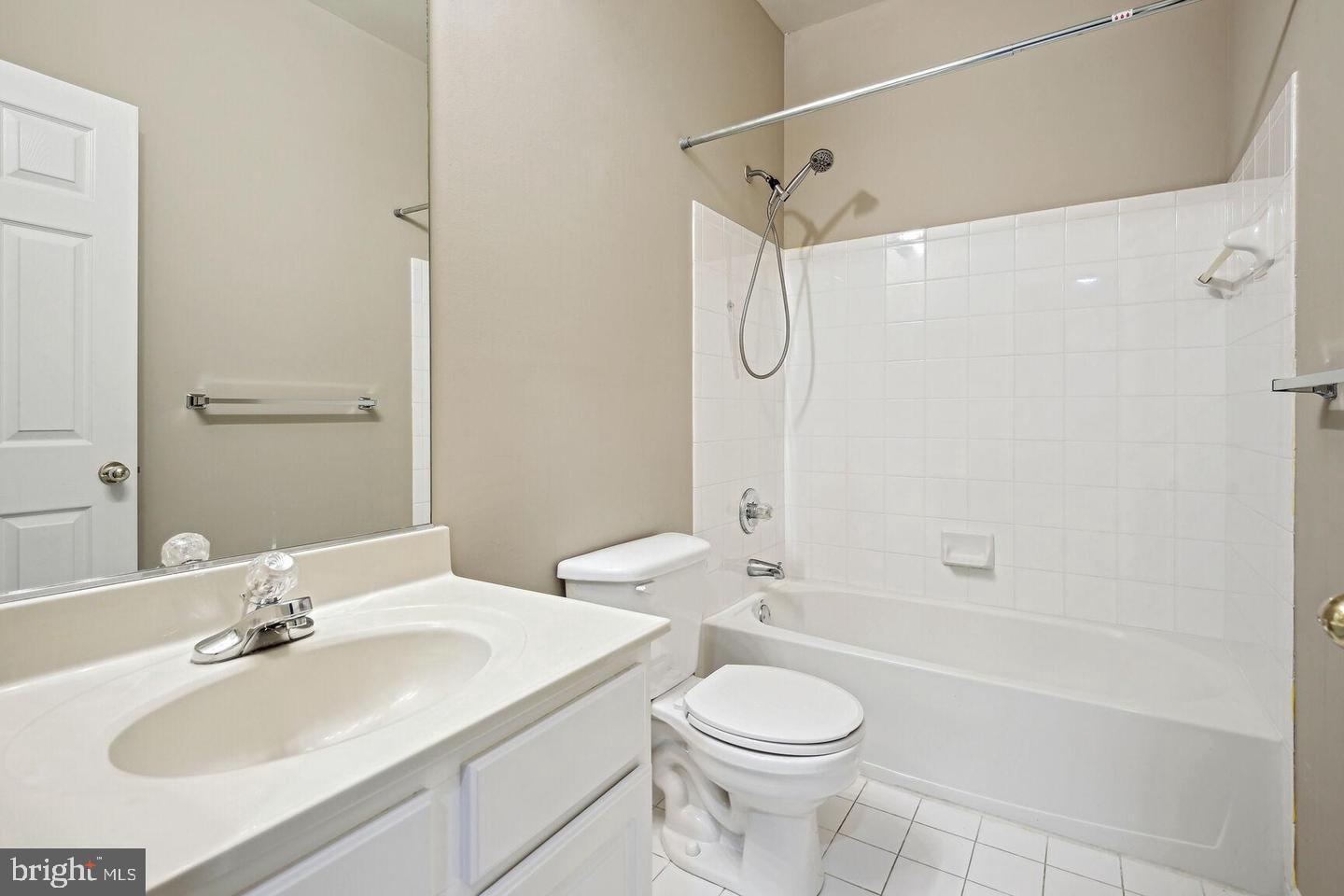 337 Main Street Gaithersburg, MD 20878 - Photo 19 of 35 a bathroom with a sink a toilet and shower