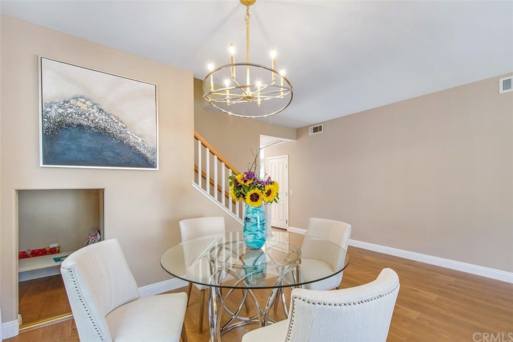 2 Ashford Irvine, CA 92618 - Photo 6 of 42 a dining room with a table and chairs