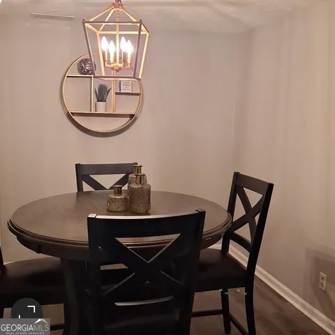 a view of a dining room with furniture