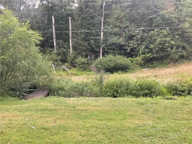 a aerial view of a house with pool
