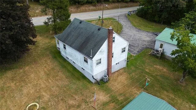 a aerial view of a house with a yard