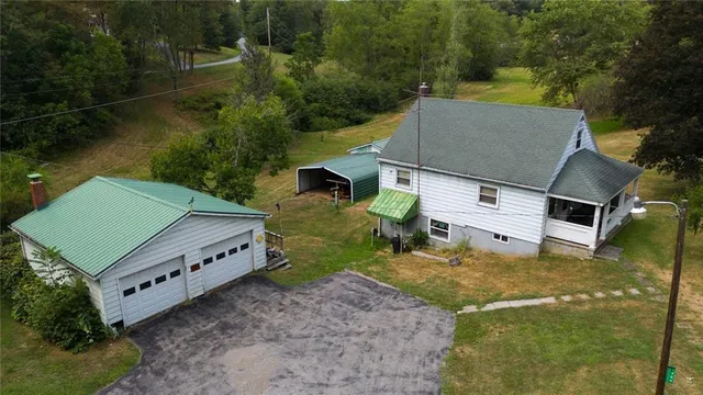 an aerial view of a house with swimming pool