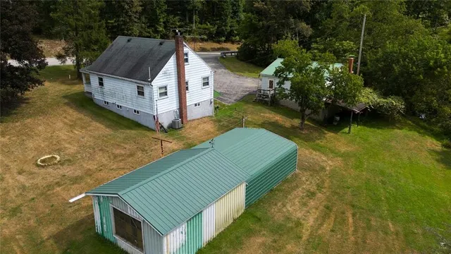 a aerial view of a house with a swimming pool