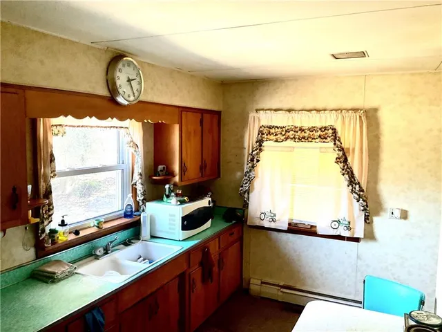 a kitchen with a refrigerator and a stove
