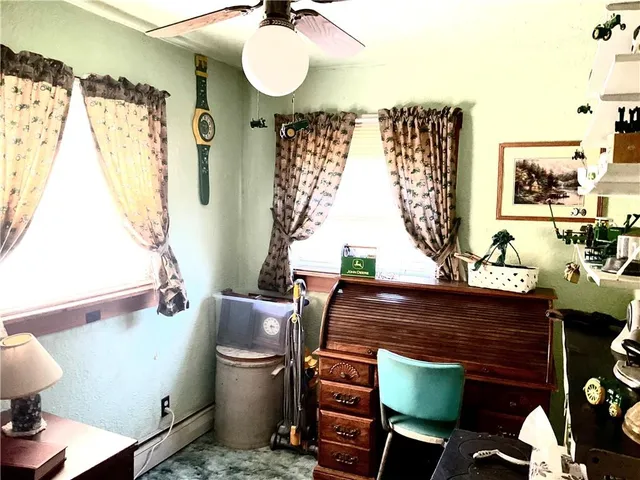 a bathroom with a sink mirror and toilet