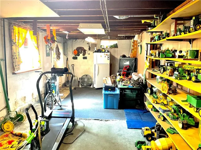 a dining room with furniture and a window