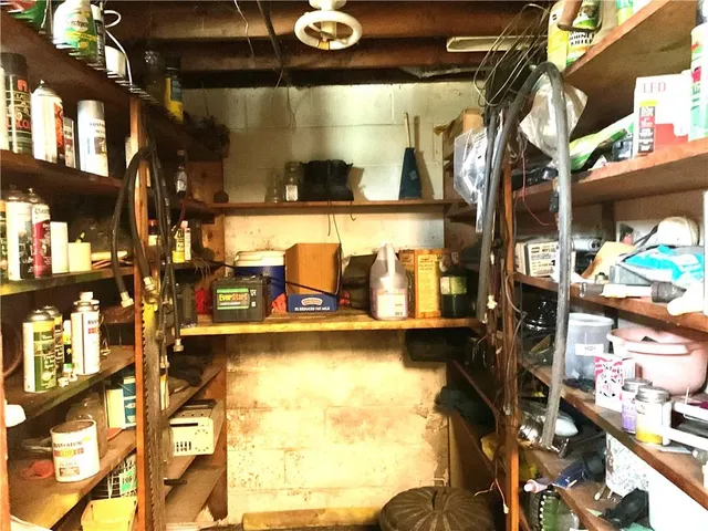 a vase of flowers sitting on a table in front of a window