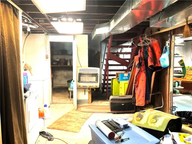 a bed room with a bed and a dresser