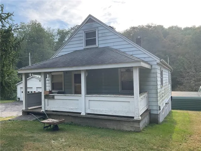 a house with trees in the background