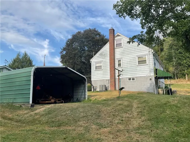 a view of a yard with a bench