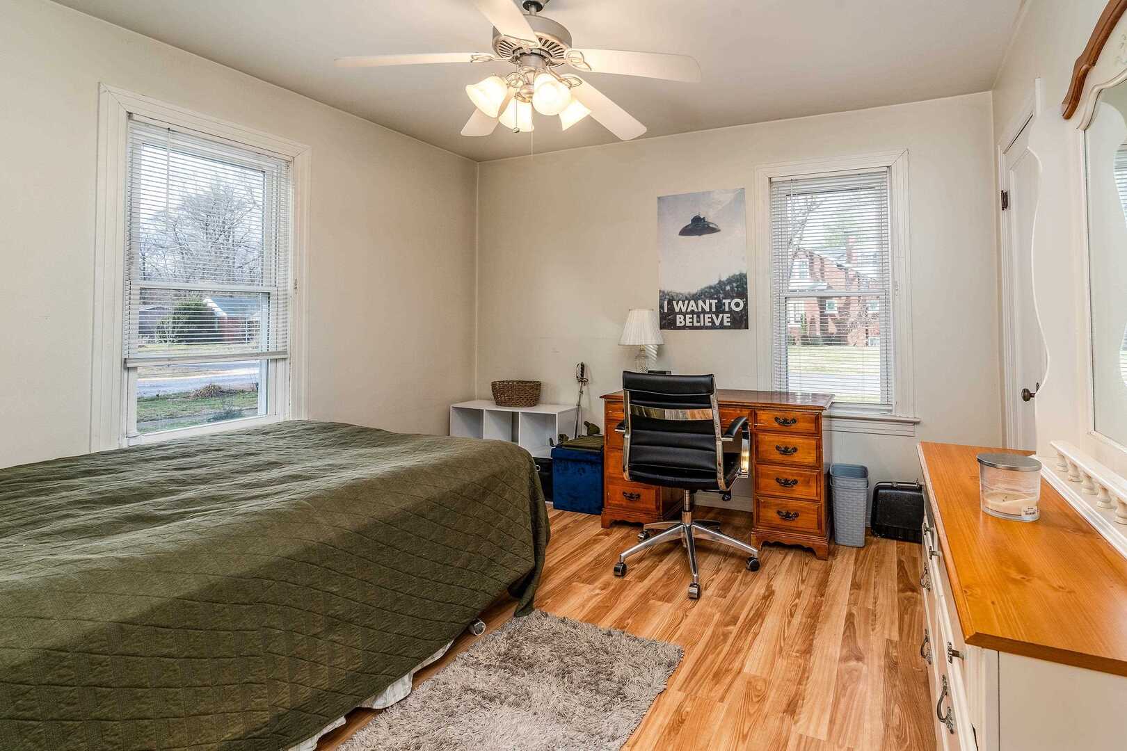 103 North 22nd Street Murphysboro, IL 62966 - Photo 15 of 23 a bedroom with a bed and wooden floor