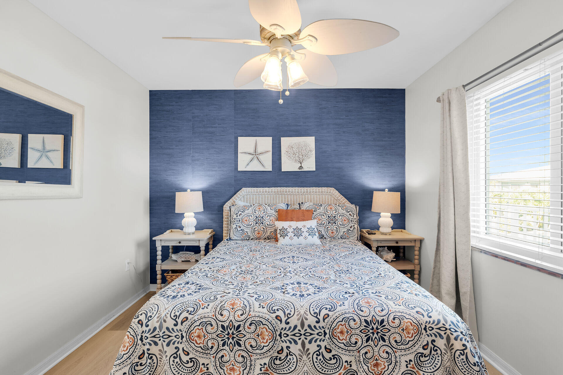 351 10th Street Key Colony Beach, FL 33051 - Photo 15 of 48 a bed sitting in a bedroom next to a window