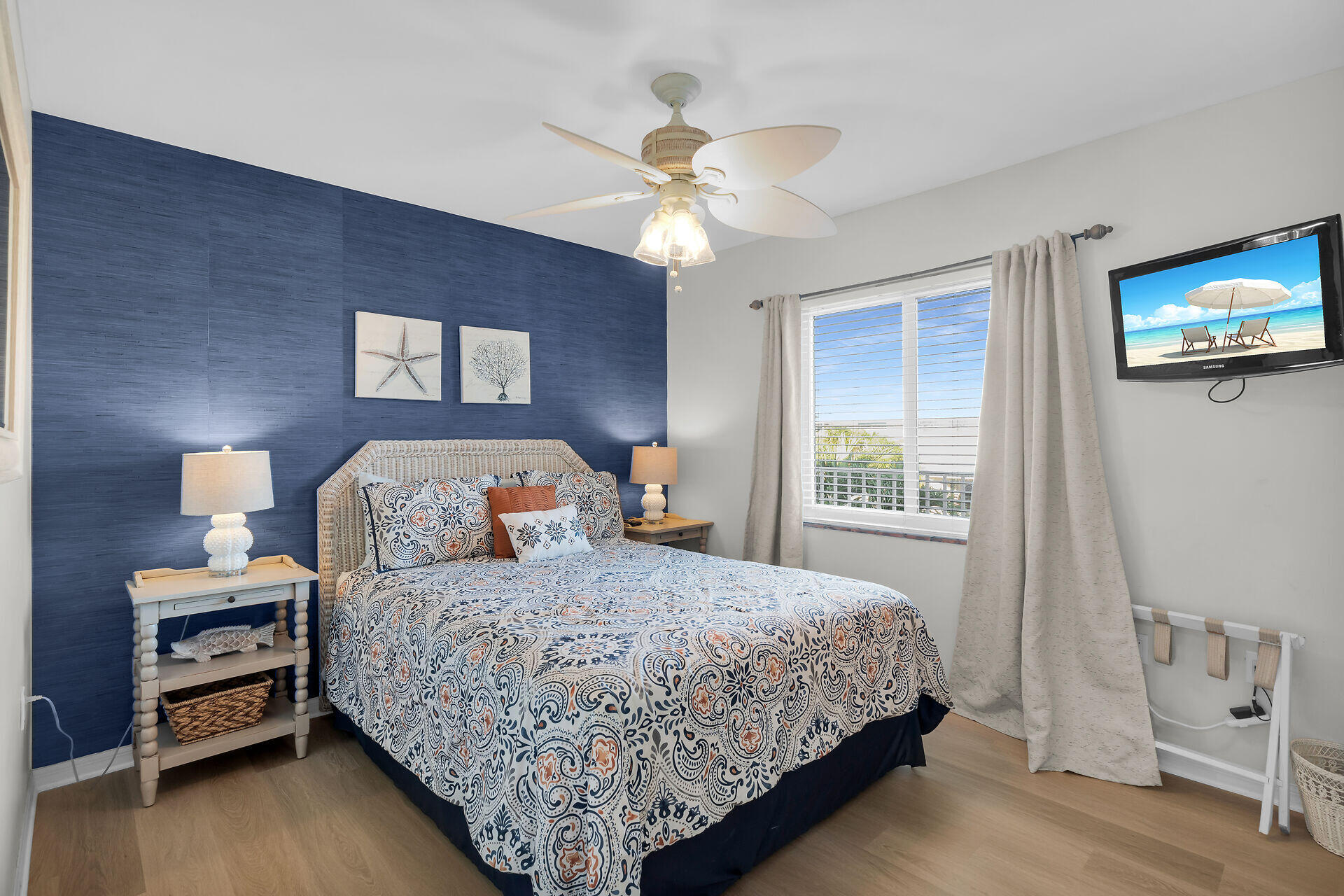 351 10th Street Key Colony Beach, FL 33051 - Photo 16 of 48 a bedroom with a bed and a chandelier