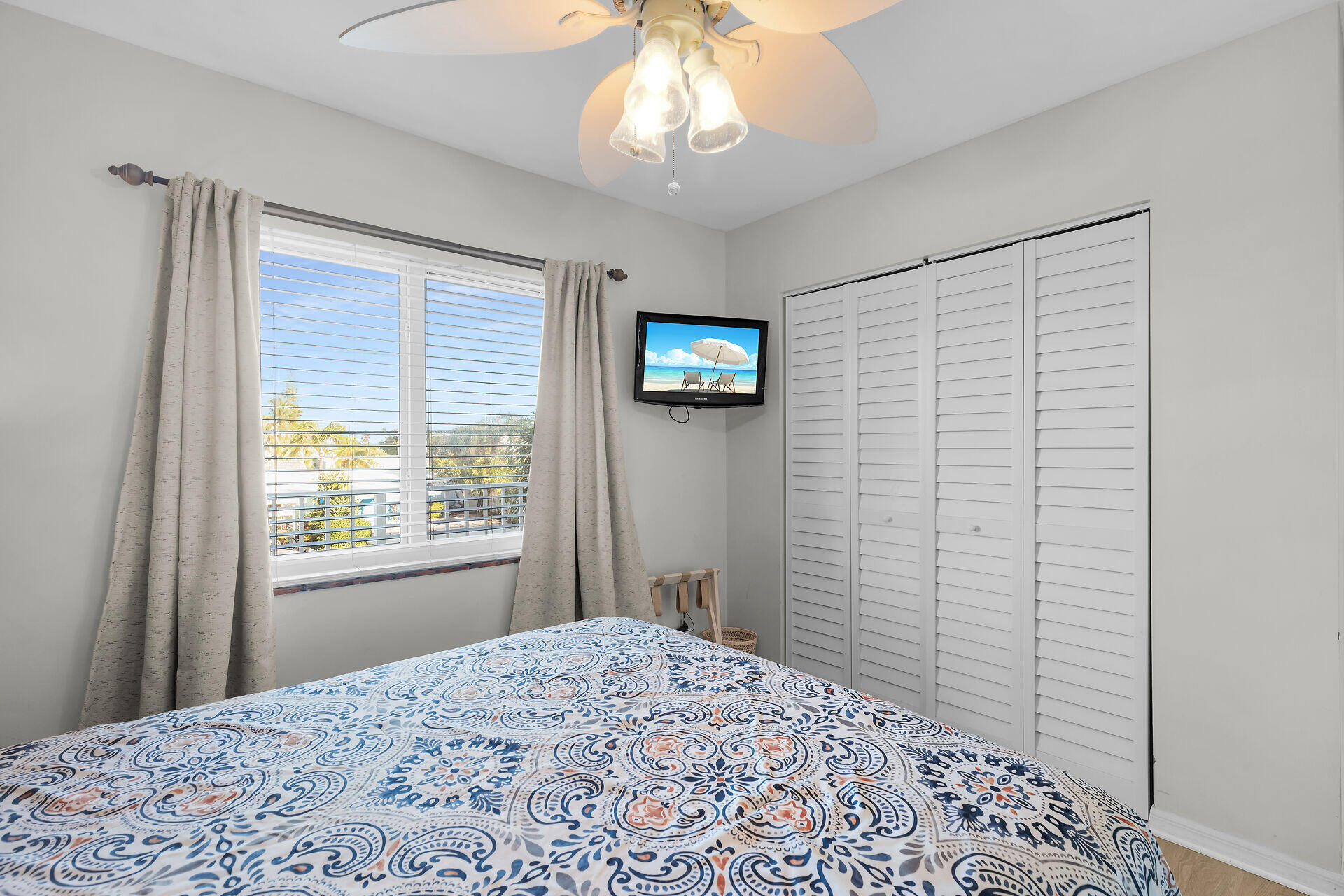 351 10th Street Key Colony Beach, FL 33051 - Photo 17 of 48 a bedroom with a bed and a window