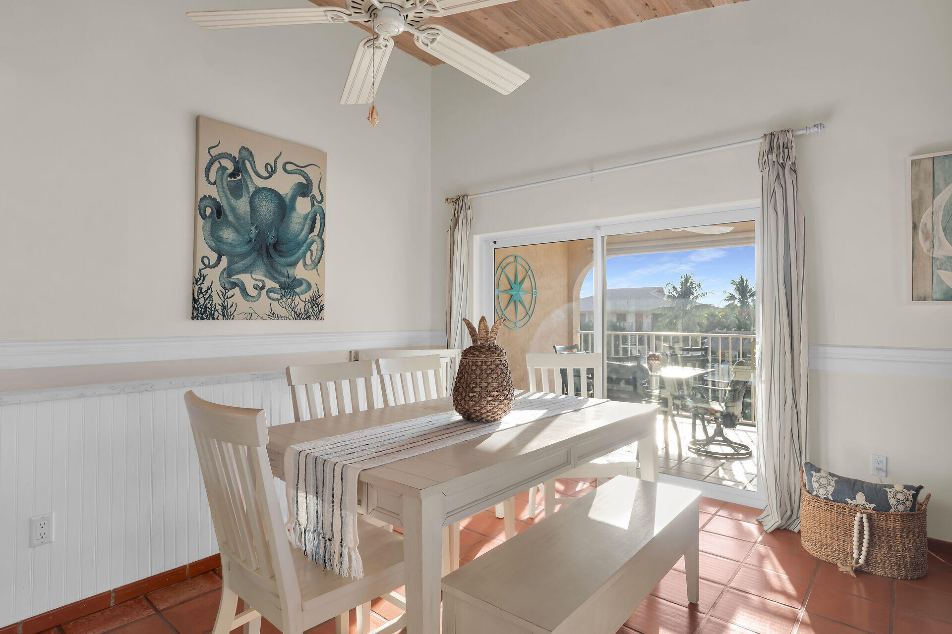 351 10th Street Key Colony Beach, FL 33051 - Photo 6 of 48 a view of a dining room with furniture window and wooden floor
