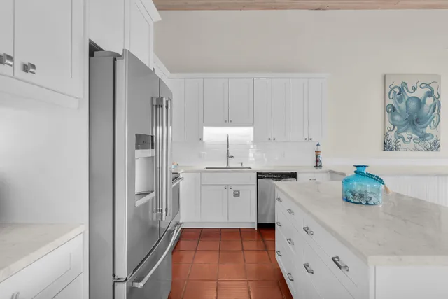 a kitchen with a sink and cabinets