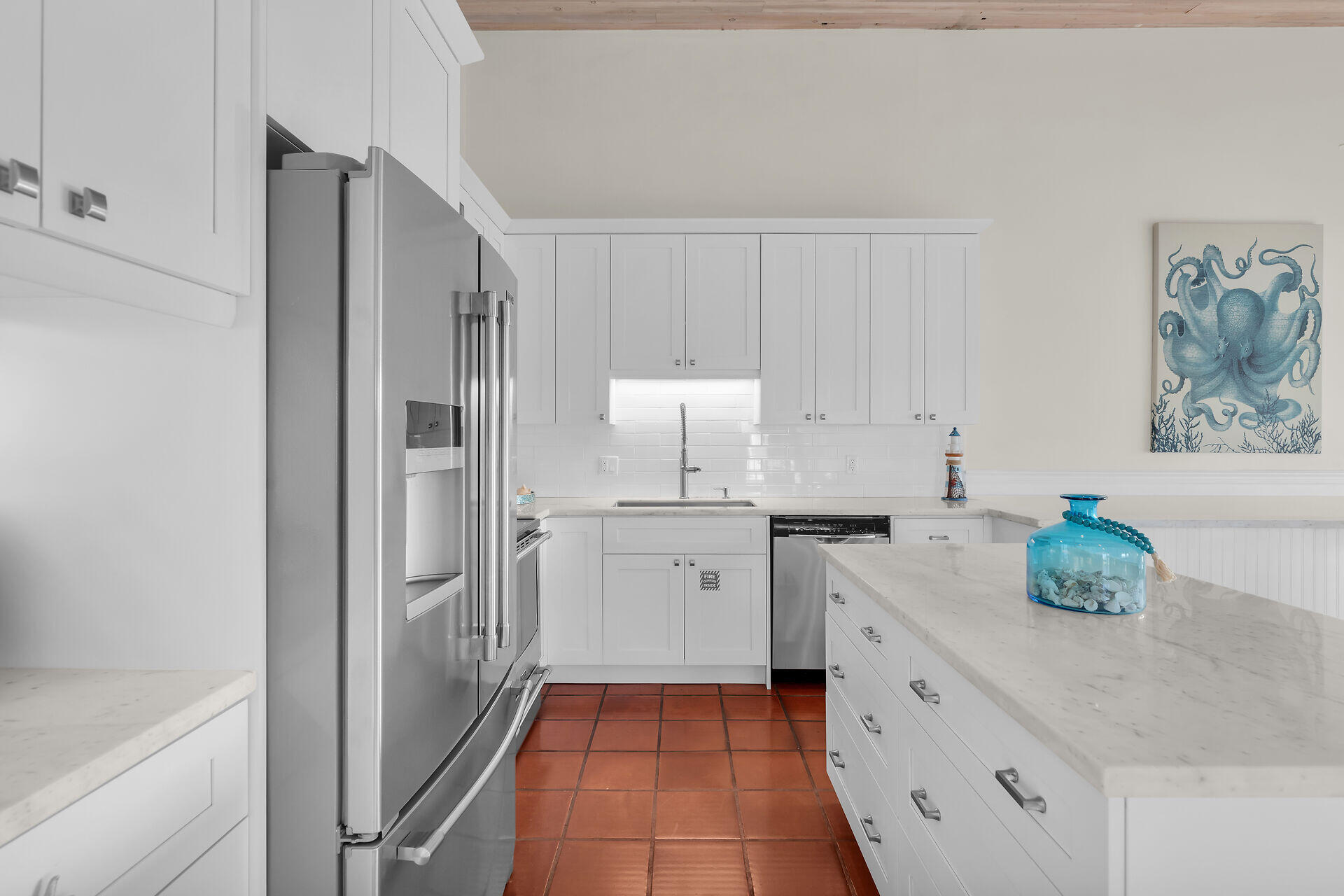 351 10th Street Key Colony Beach, FL 33051 - Photo 10 of 48 a kitchen with a sink and cabinets