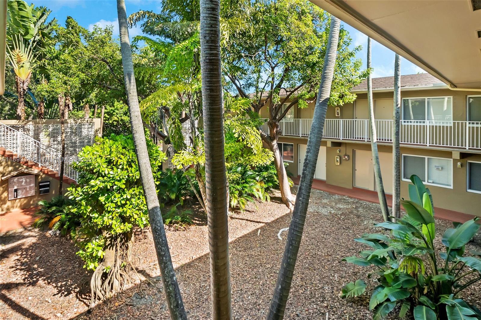 6310 Southwest 79th Street, Unit 19 South Miami, FL 33143 - Photo 8 of 8 a view of a backyard