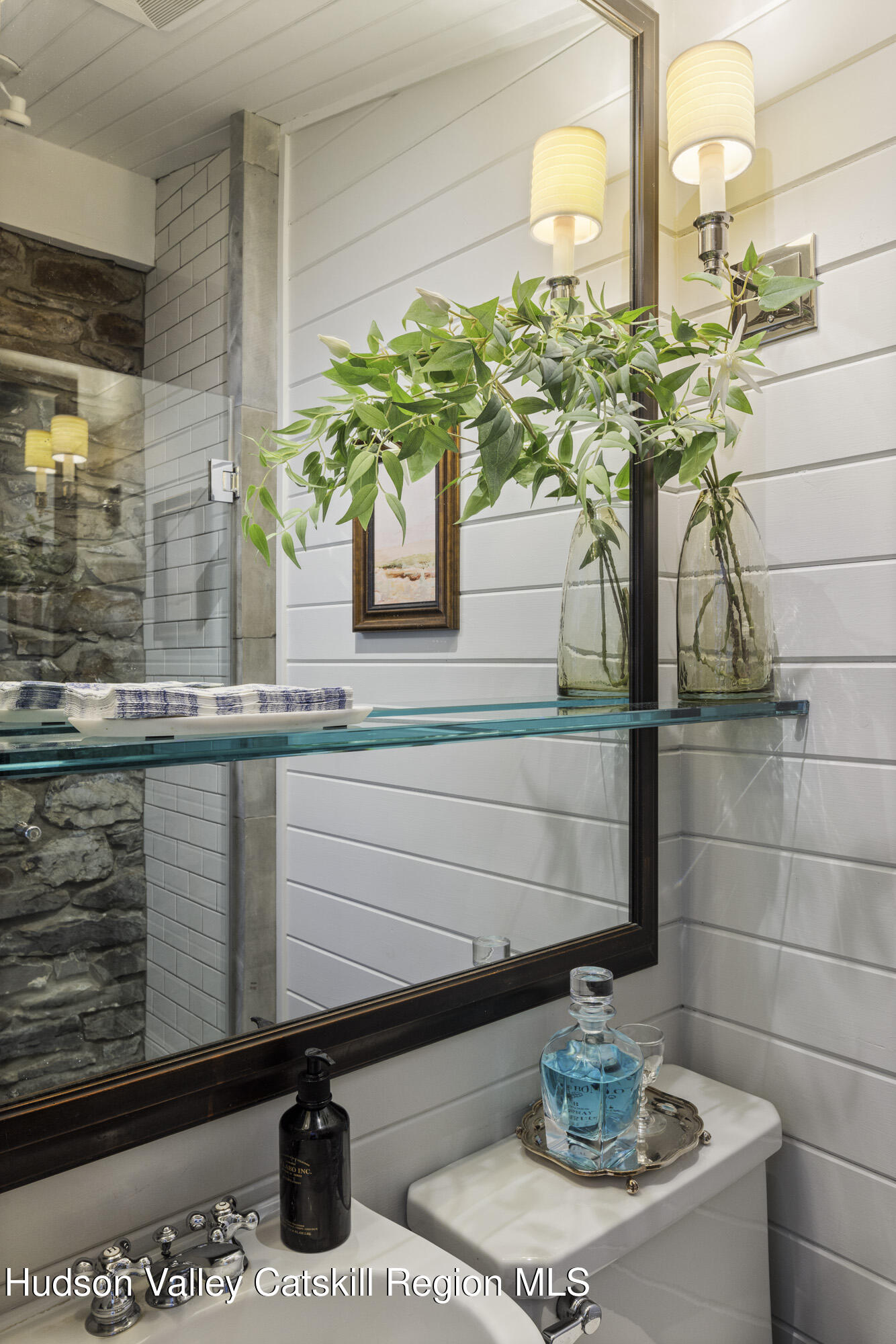 2887 Highway 209 Marbletown, NY 12401 - Photo 16 of 33 a bathroom with a sink a mirror and a potted plant