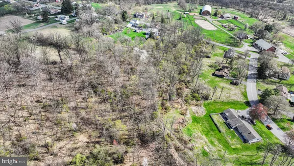 a backyard of a house with lots of trees