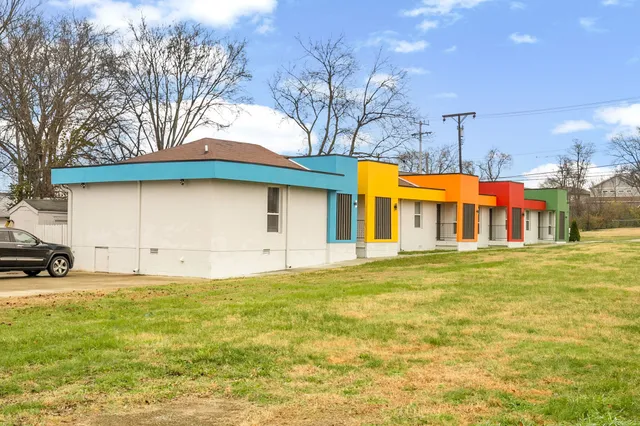 a front view of house with yard and trees
