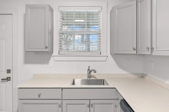 a bathroom with a sink and a window