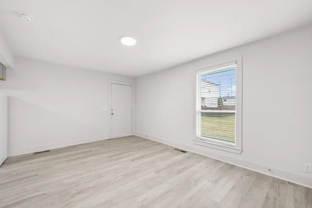 a bathroom with a shower a toilet and sink