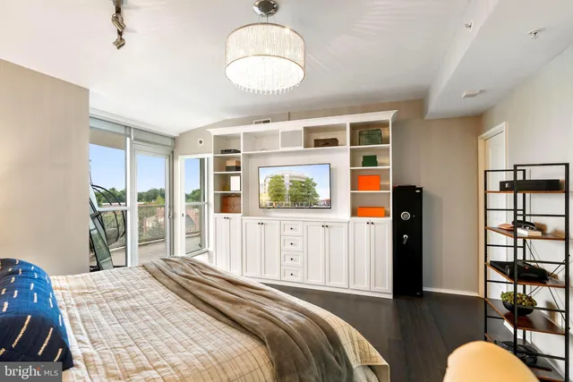 a bedroom with a large bed and a window