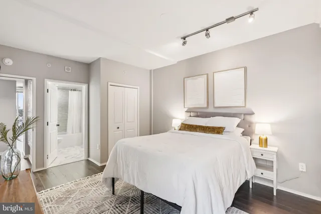 a bedroom with a bed and a table in it