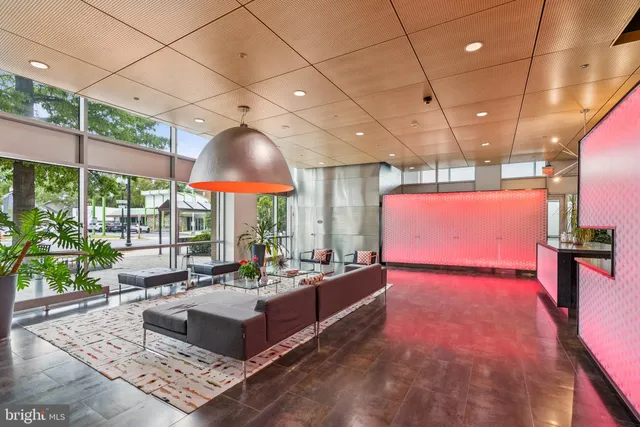 a living room with couch and a flat screen tv