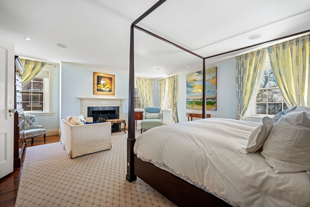 1 West Hill Place Boston, MA 02114 - Photo 13 of 22 a bedroom with a large bed and a large window