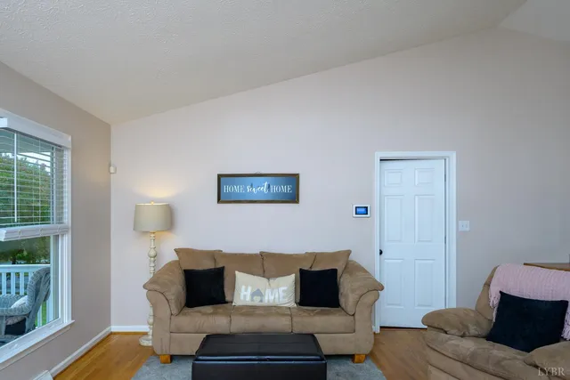 a large kitchen with stainless steel appliances granite countertop a stove a sink dishwasher a microwave oven with cabinets and wooden floor