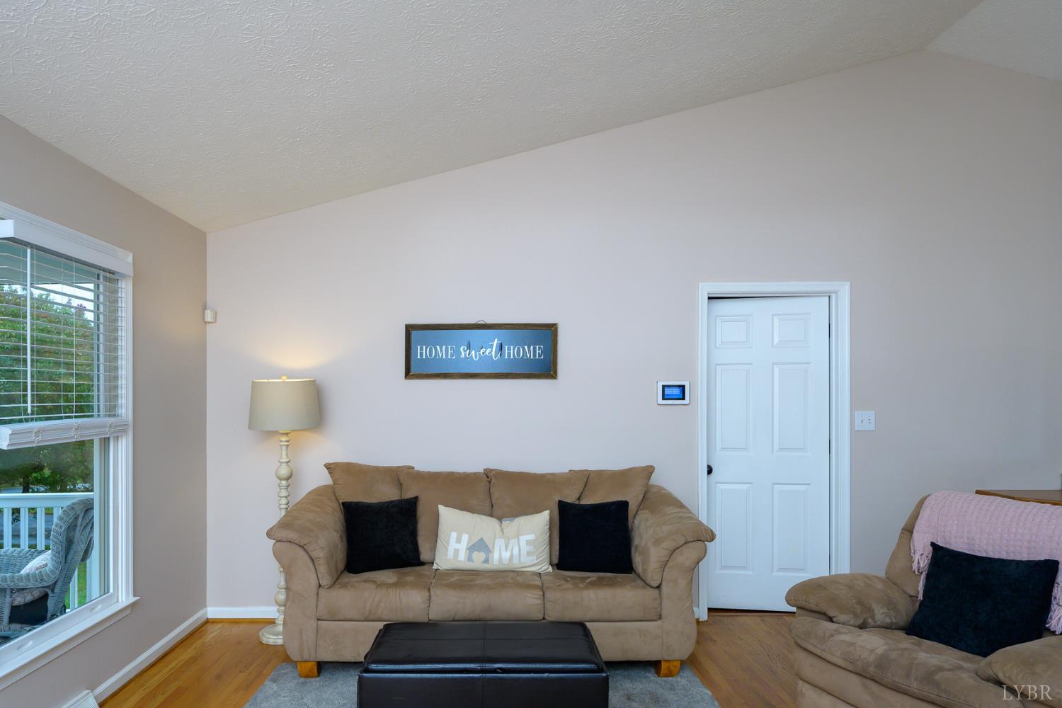 151 Wilderness Road Rustburg, VA 24588 - Photo 16 of 63 a living room with furniture and a window