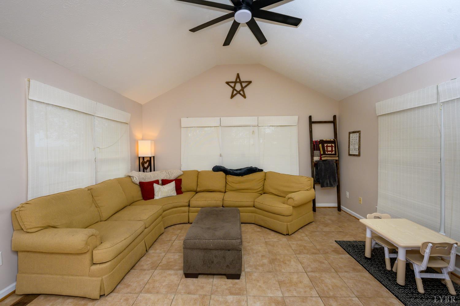 151 Wilderness Road Rustburg, VA 24588 - Photo 18 of 63 a living room with furniture and a ceiling fan