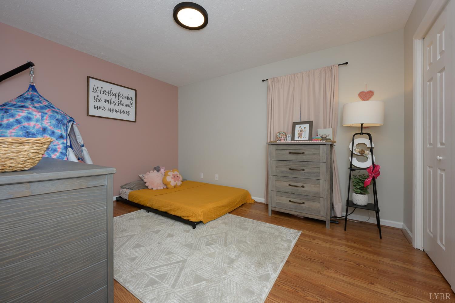 151 Wilderness Road Rustburg, VA 24588 - Photo 20 of 63 a bedroom with a bed and furniture